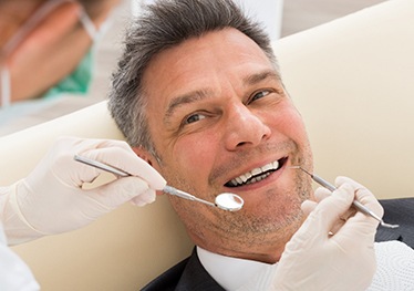 Man at dentist for dental implants in Garland