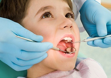 Young child receiving dental exam