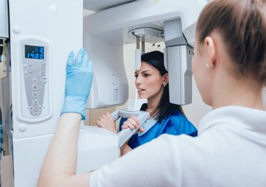 A woman receiving a cone beam scan.