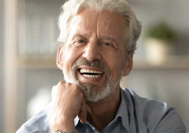 A man enjoying his dentures in Garland