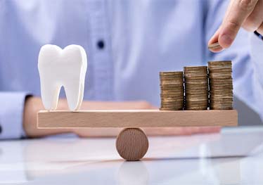 stack of coins and tooth