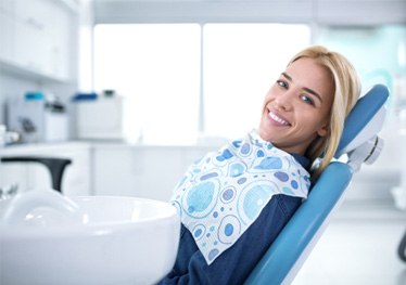 Smiling woman sitting in dental office