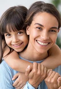 Mom and daughter smiling together in Murphy, TX