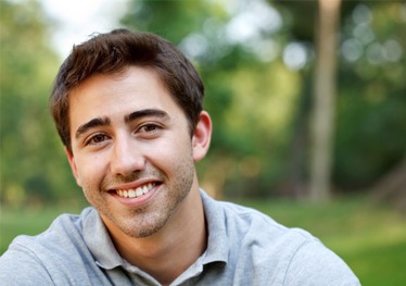 Man smiling outside