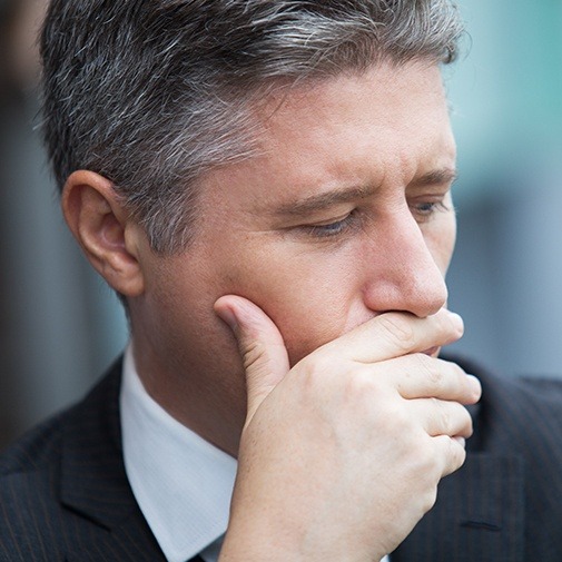 Man covering his mouth