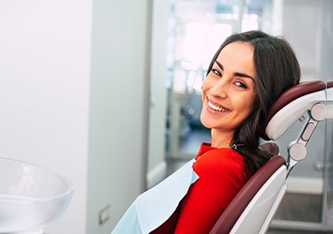 Female patient with red shirt at dentist’s office