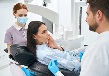 Dental patient consulting with dentist