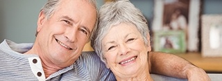 Smiling older man and woman outdoors