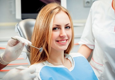 A young woman in the dentist chair