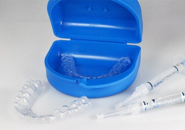 Closeup of take-home teeth whitening kit in Garland 